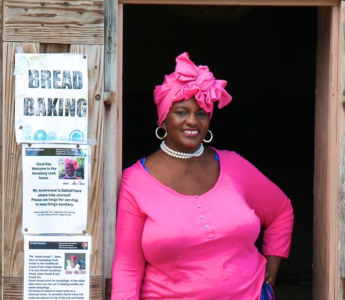 Woman leaning in the doorway of Annaberg Cookhouse